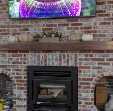 This is a picture of a fireplace renovation that was constructed by Slinkard Enterprise in Grove OK